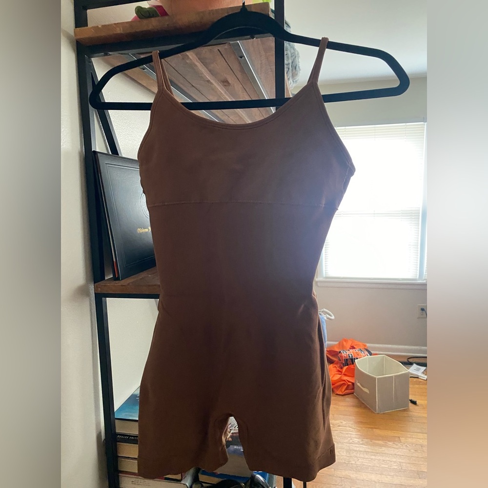 Brown body suit
